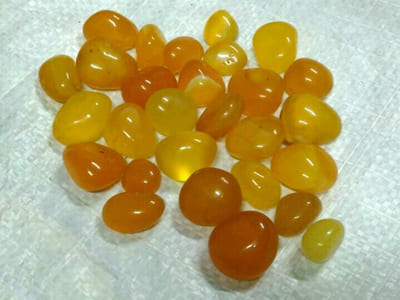 yellow-onyx-oval-round-shape-stones-tumbled-glossy-transparent-polished-decorative-pebbles-exporter-supplier-manufacturer-trader